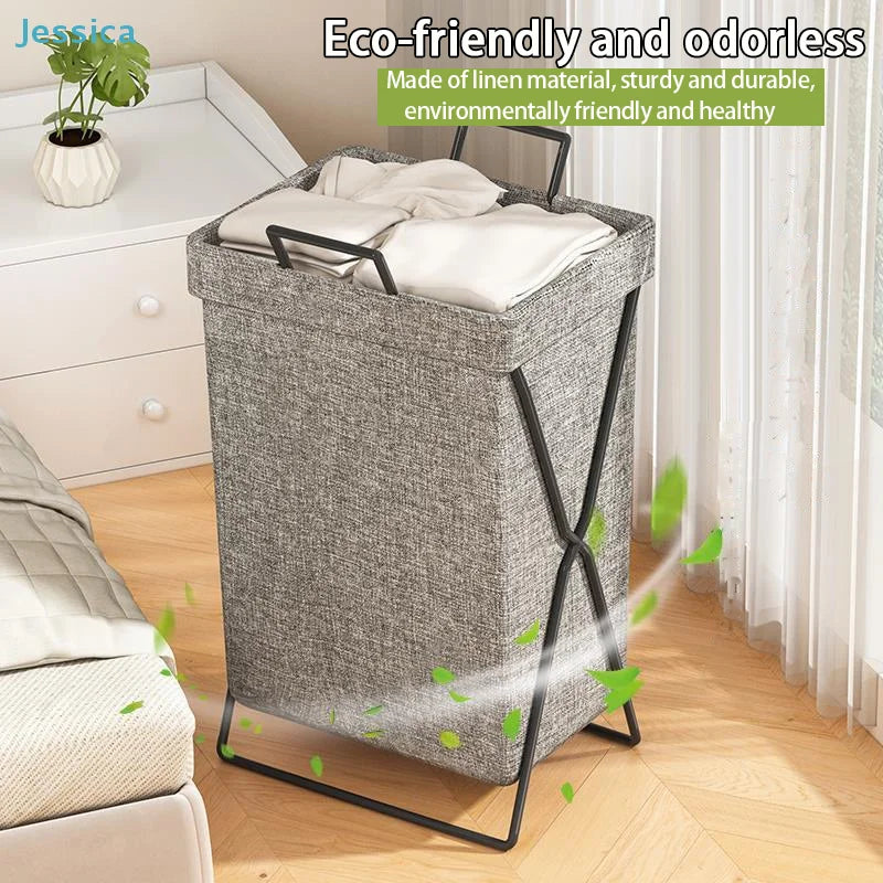 Foldable collapsible fabric laundry hamper with handles in bedroom setting