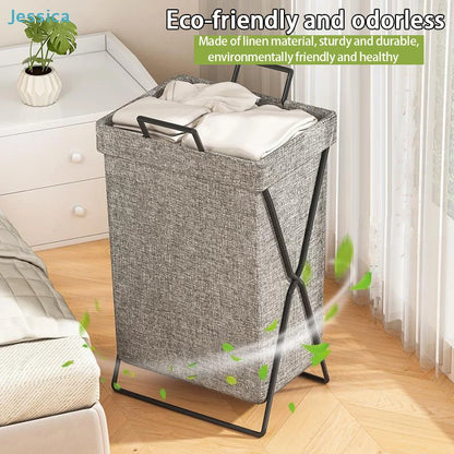 Foldable collapsible fabric laundry hamper with handles in bedroom setting