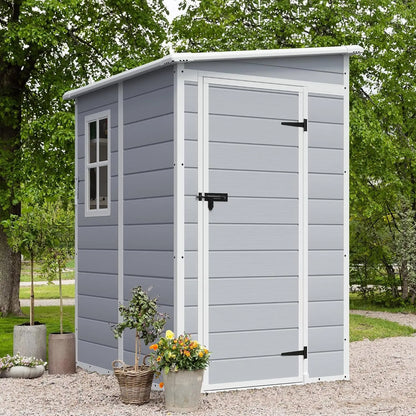 Outdoor 5x4 FT resin storage shed with lockable door and heavy-duty floor in backyard setting