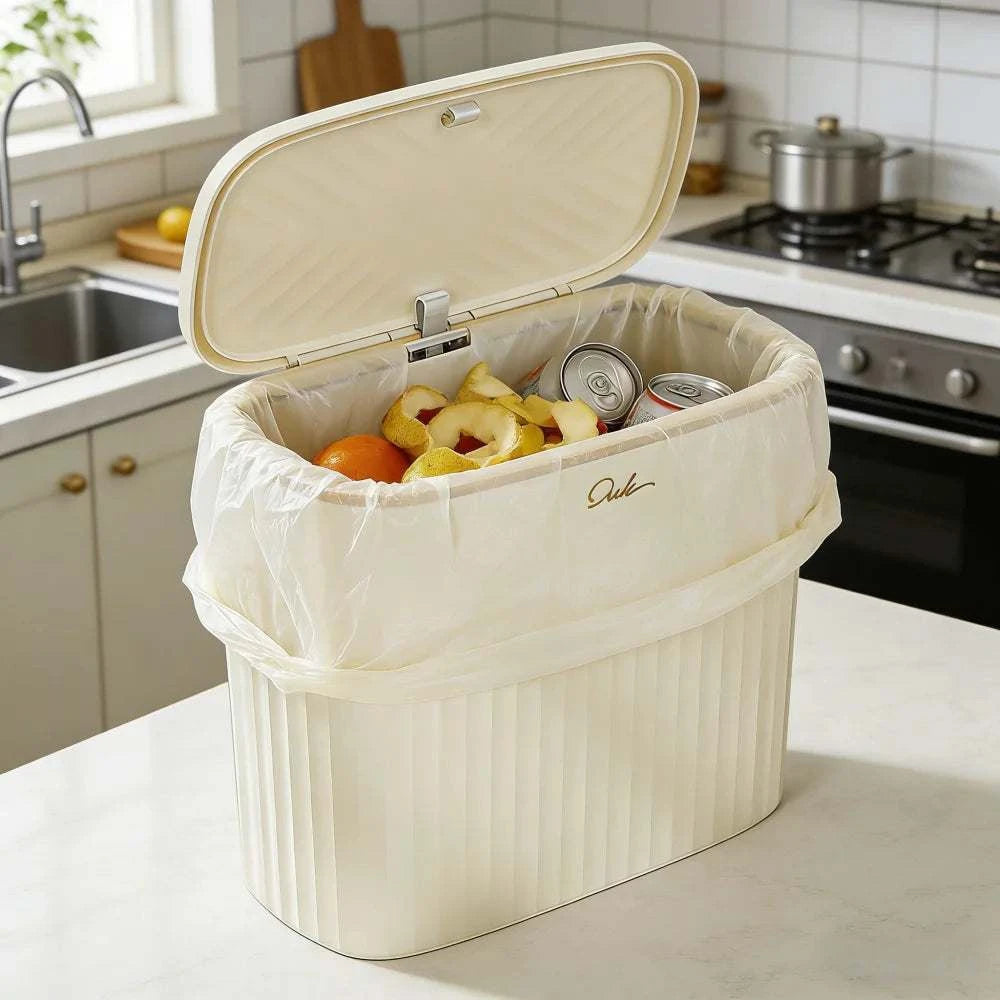 Beige gold trim slim narrow trash can with press-to-open lid for bathroom and kitchen use